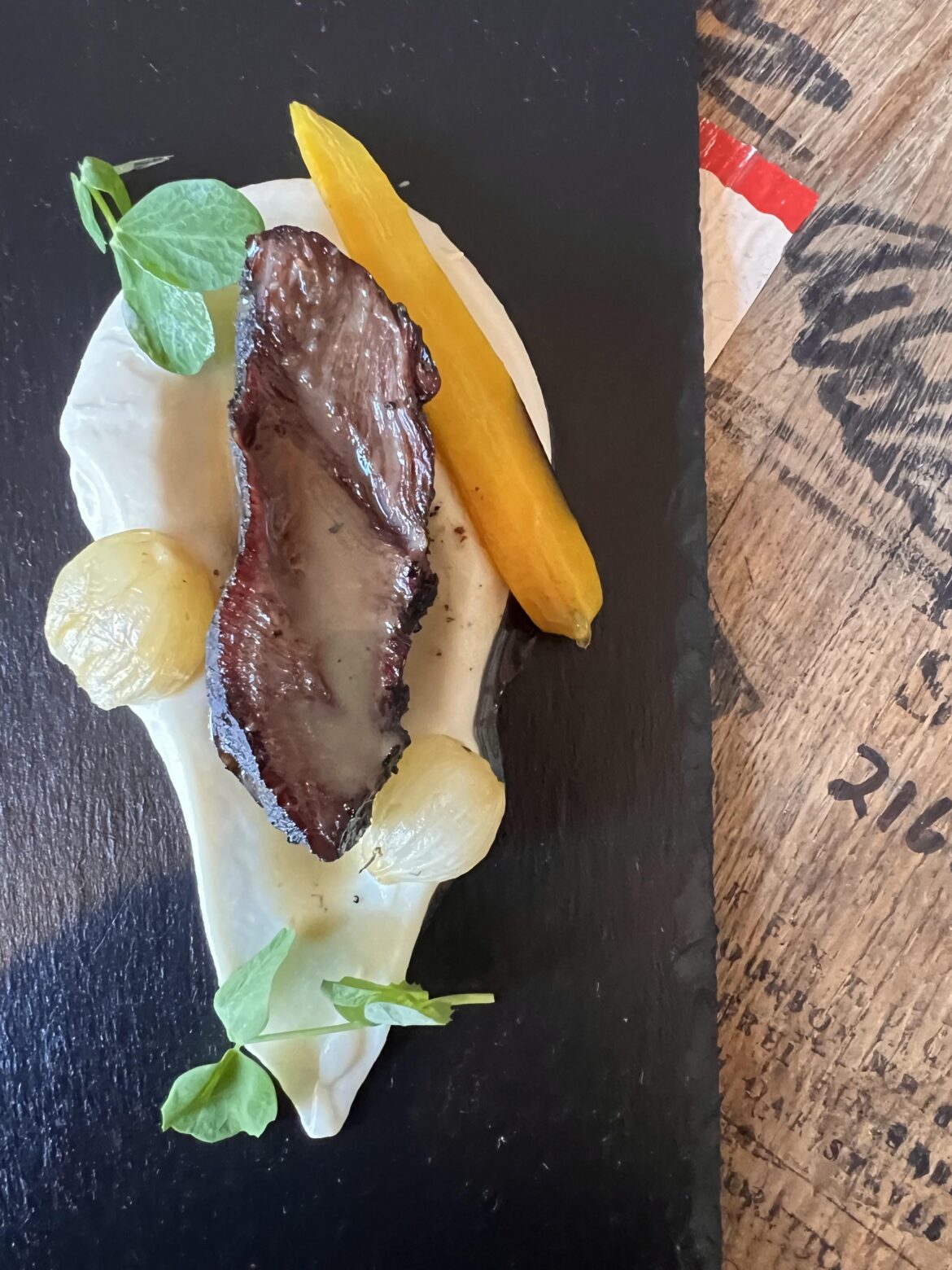 Slow smoked Beef Cheek, cauliflower puree,confit carrot,slow roasted pearl onions, smoked Demi