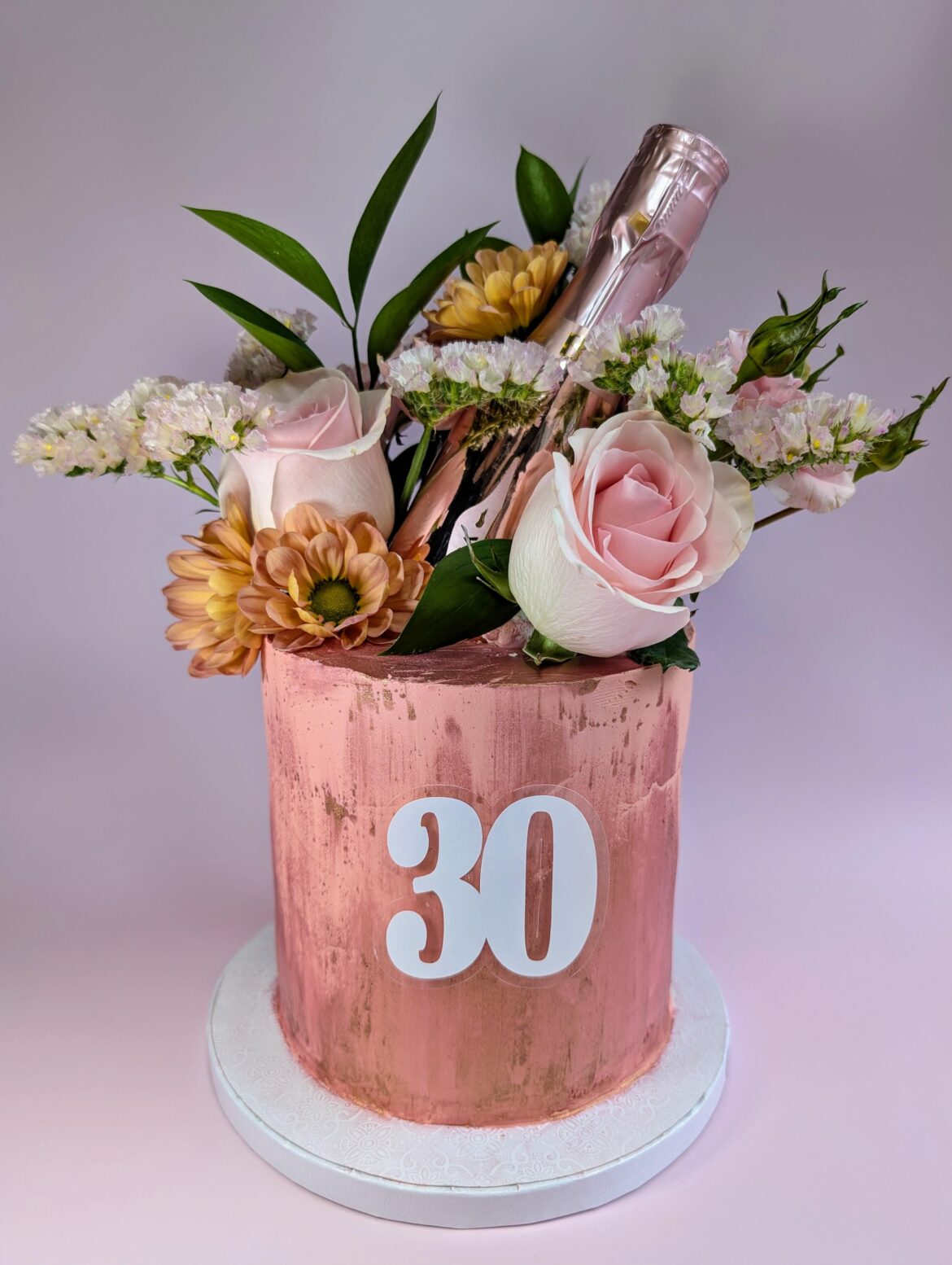 I made a flower cake for a 30th champagne birthday