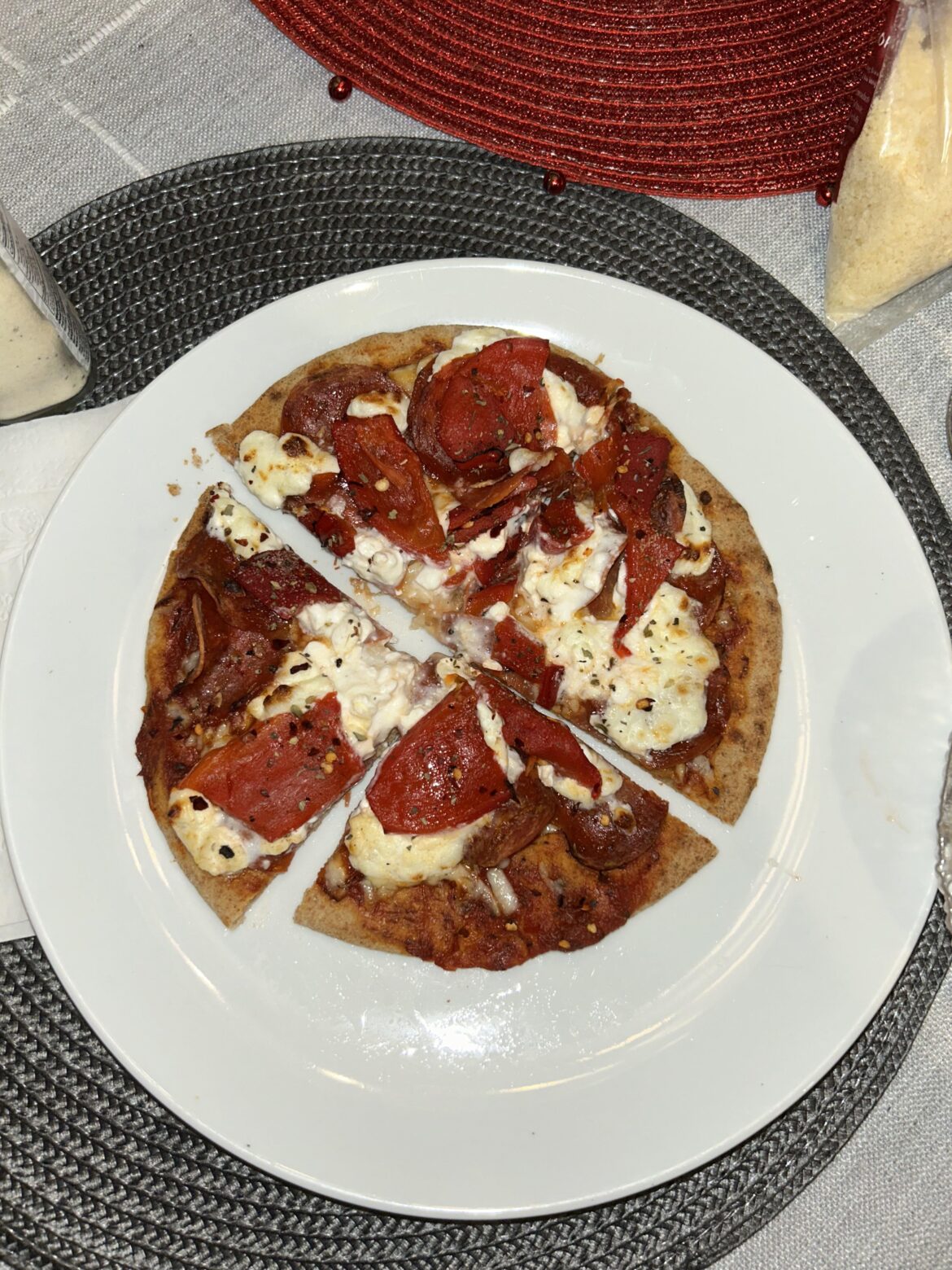 500 calories + 32 grams of protein for this red pizza on whole wheat pita with mozz, cottage cheese, turkey ronis and roasted red