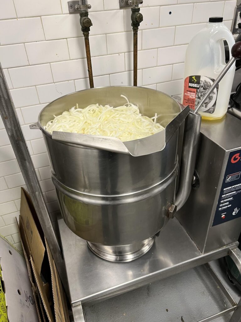 Big ol’ batch of caramelized onions at work