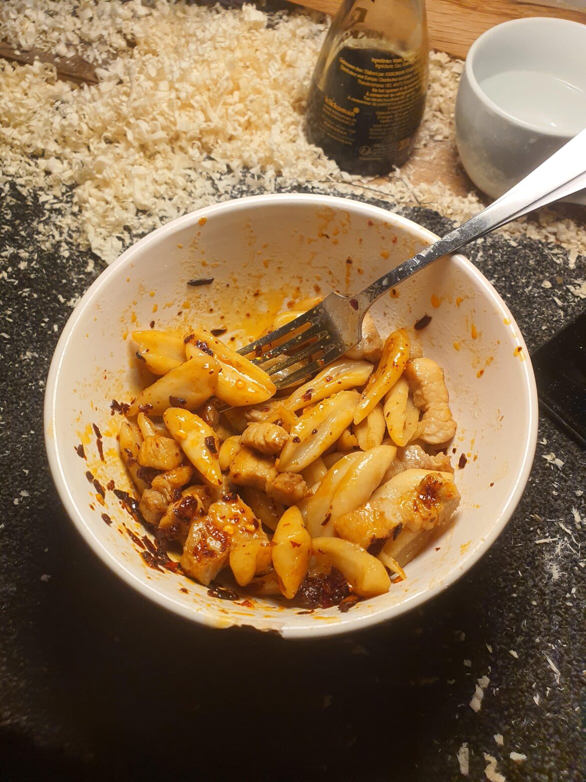 Cut up, boiled dough pieces. Fried pork and chili oil. My poverty meal