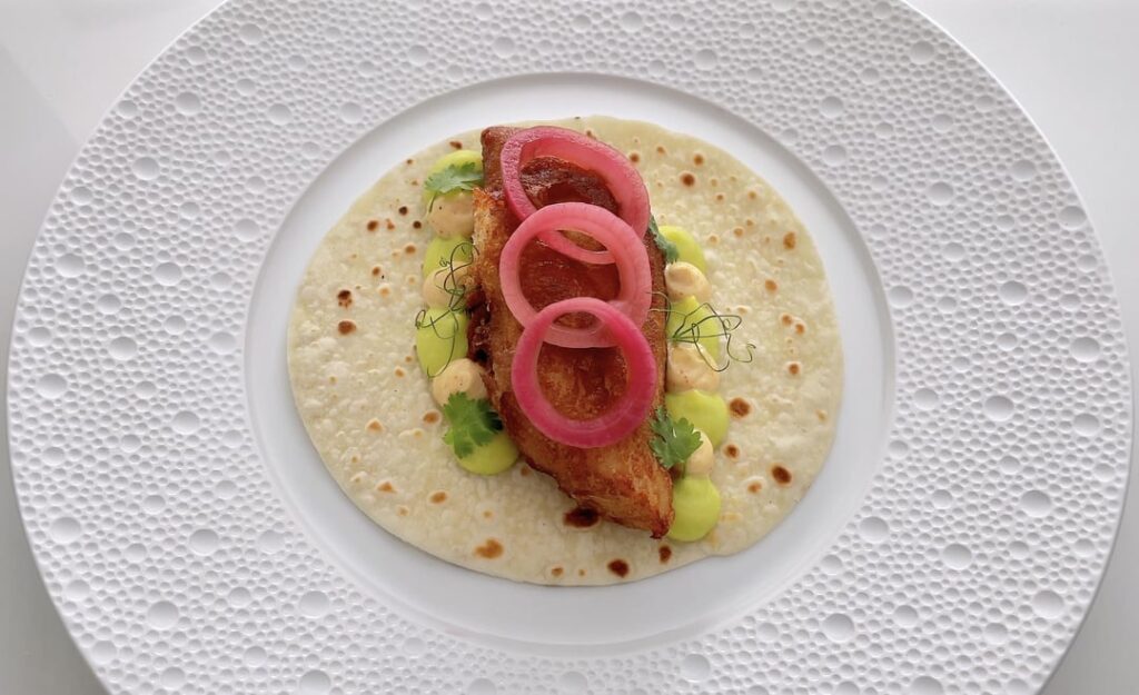 Fish Tacos with Beer Battered Fish, Avocado Crema, Spicy Mayo & Pickled Onions