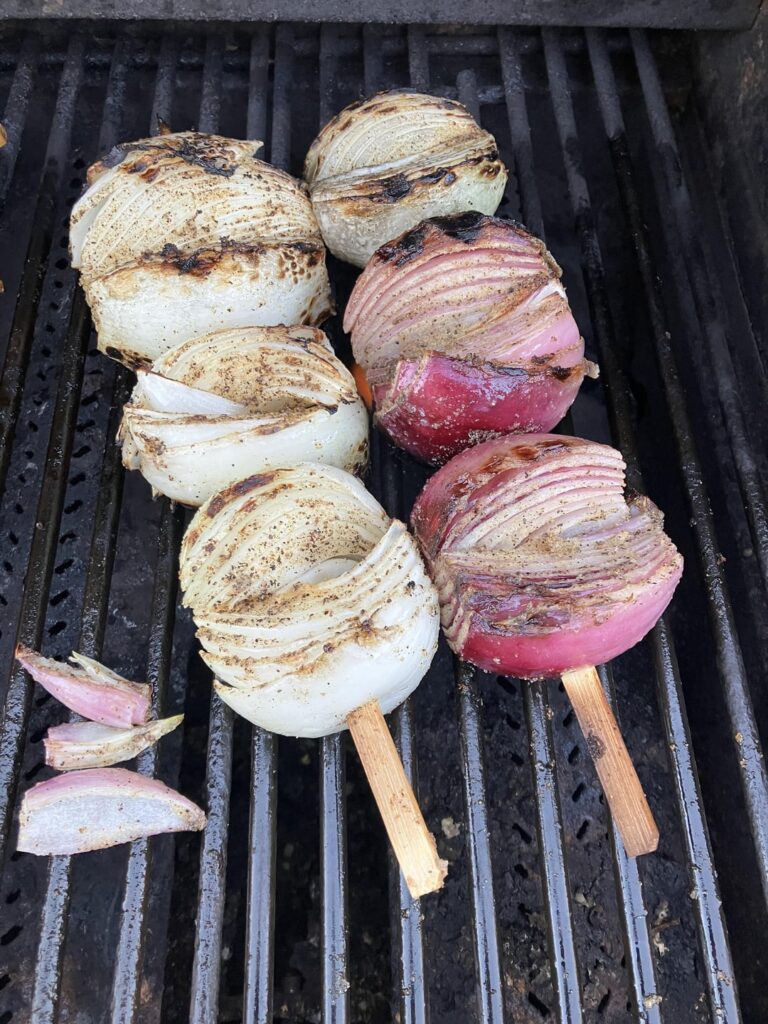 I only had one red and a couple of white onions on had, so I grilled them with some beef skewers and some red bells.