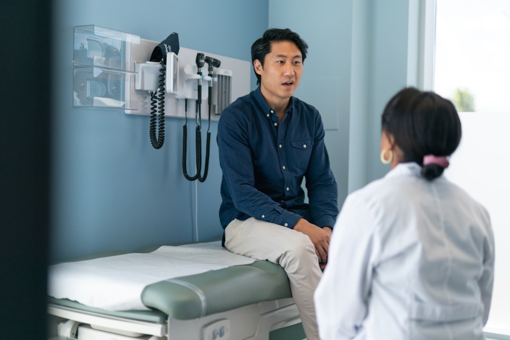 Man talking to doctor 