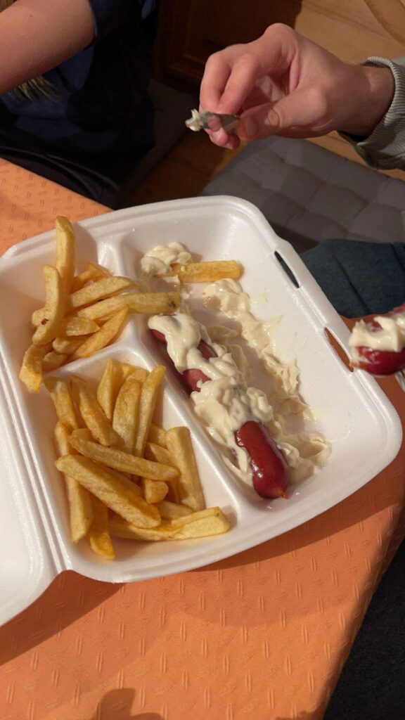 My friend orders his currywurst with mayo instead of the tomato curry sauce