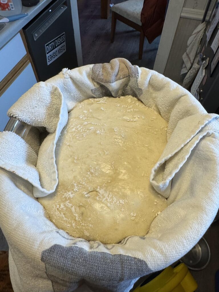 Anyone have any tips for preventing your perfectly shaped and delicately handled dough from sticking to the excessively floured towel in the proofing bowl after 12 hours?