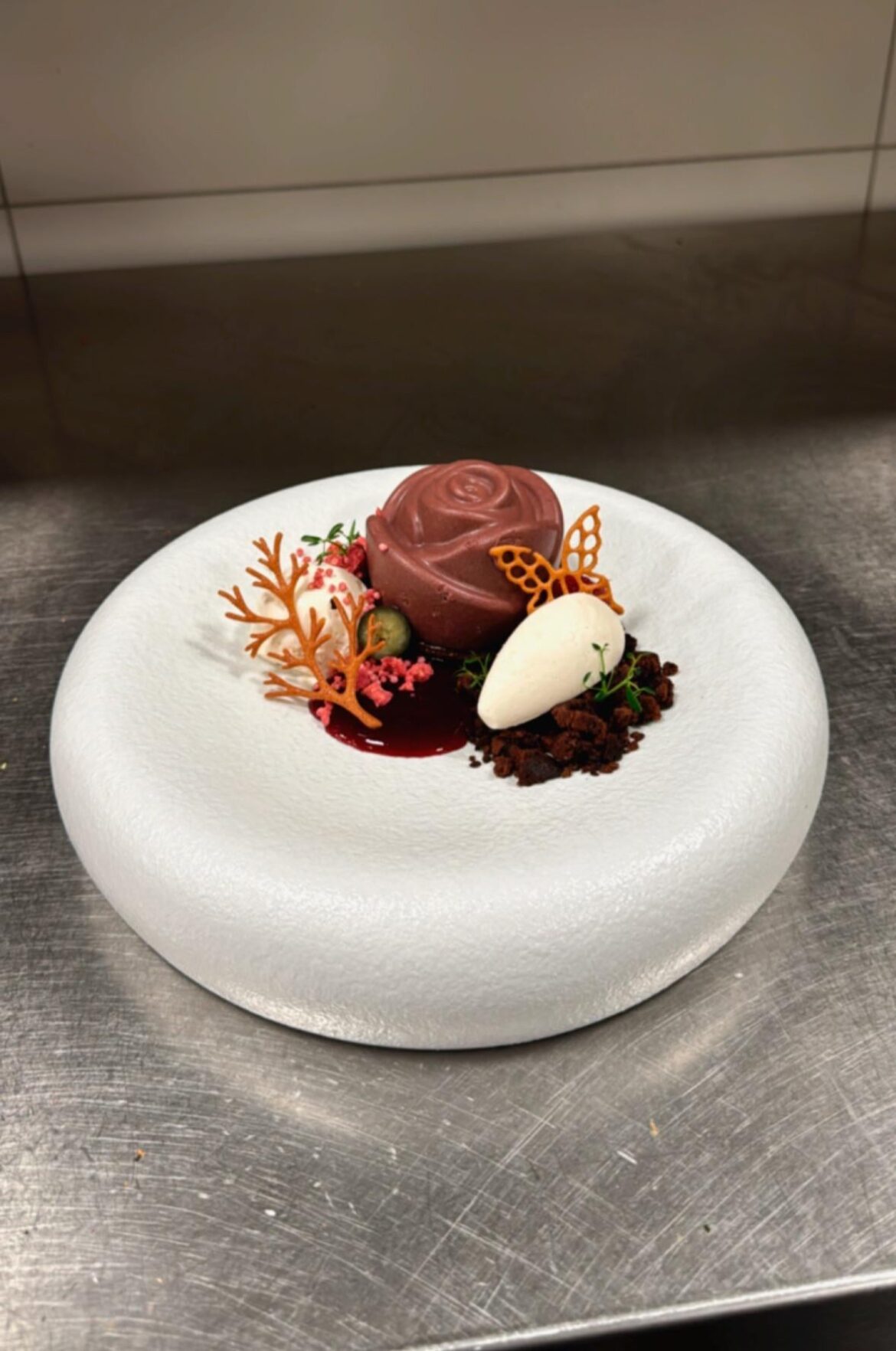 Forestfruit mousse with milk chocolate and cabernet sauvignon, Yoghurtmousse with hibiscus and lime, forestfruit sauce with violetsirup