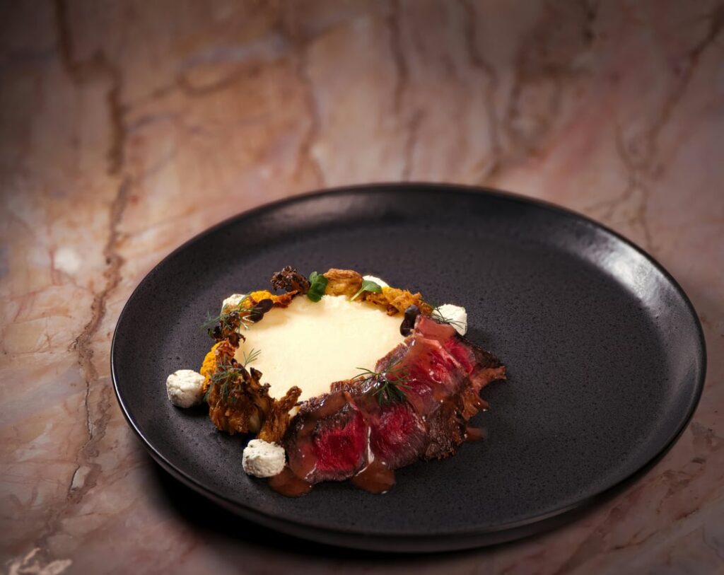 Steak, potatoes, and mushrooms.