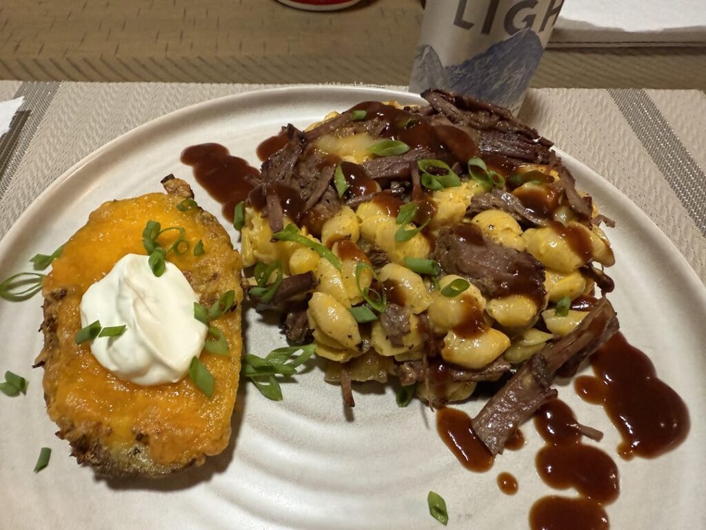Had some leftover smoked brisket from this weekend. Mixed it up with some krafts mac n cheese shells. Half baked potato on the side with cheddar and sour cream.