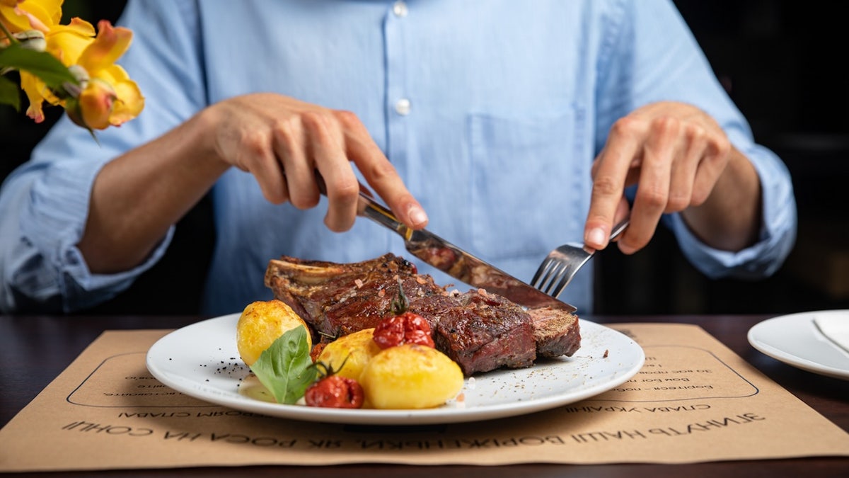 Man eating steak