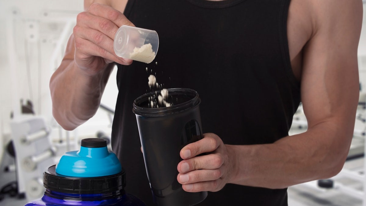 Man scooping creatine
