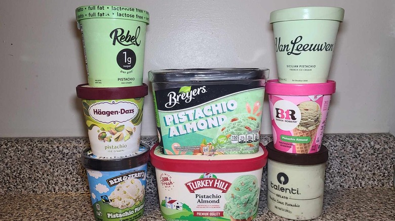 Stacks of pistachio ice cream containers
