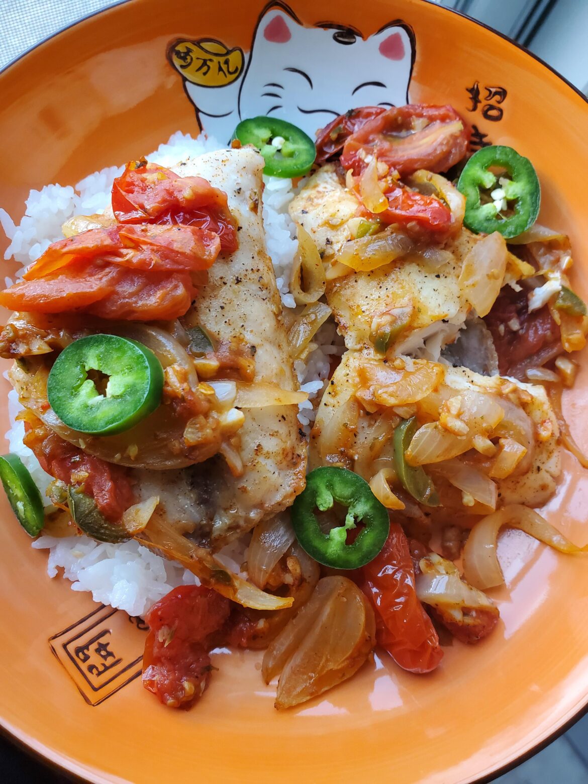 Frozen red snapper was on sale for $6.99 so here's my first attempt cooked with grape tomatoes, onion and lots of garlic.