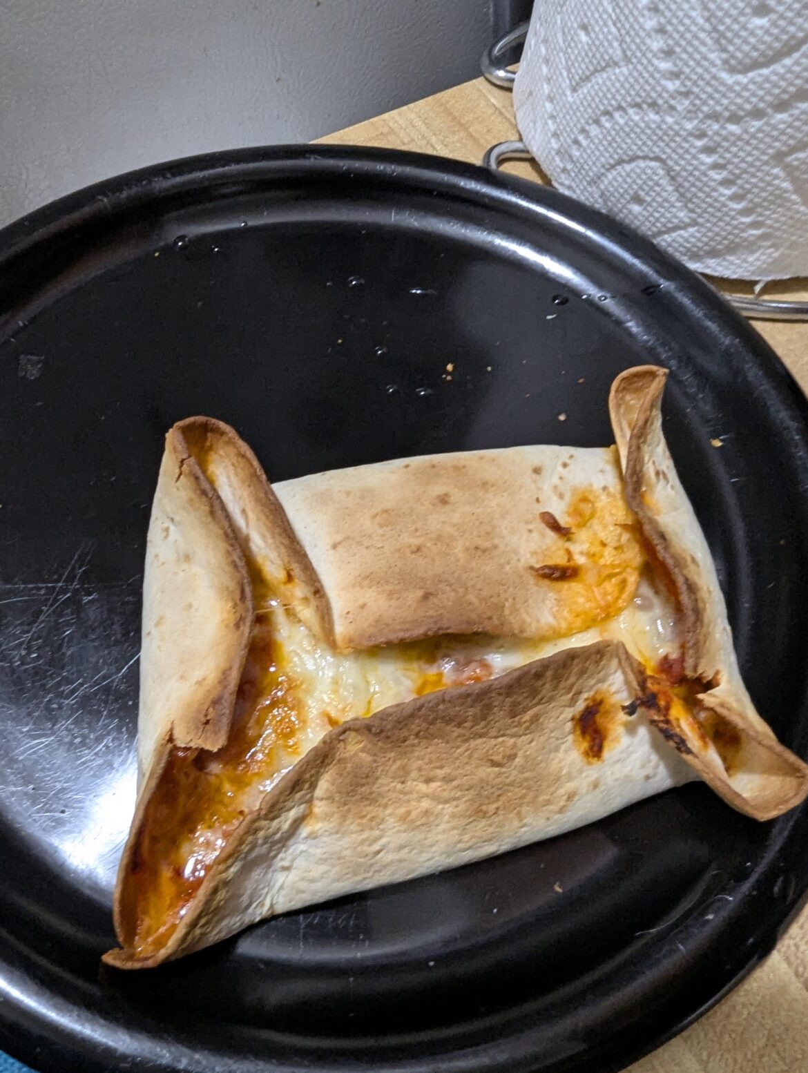 I tried to be fancy and fold my tortilla pizza into a pizza quesadilla. I failed.