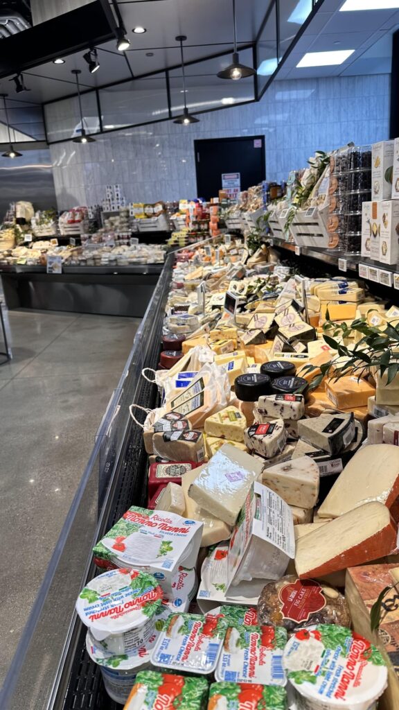 The great cheese selection at a local market that just opened a week ago.