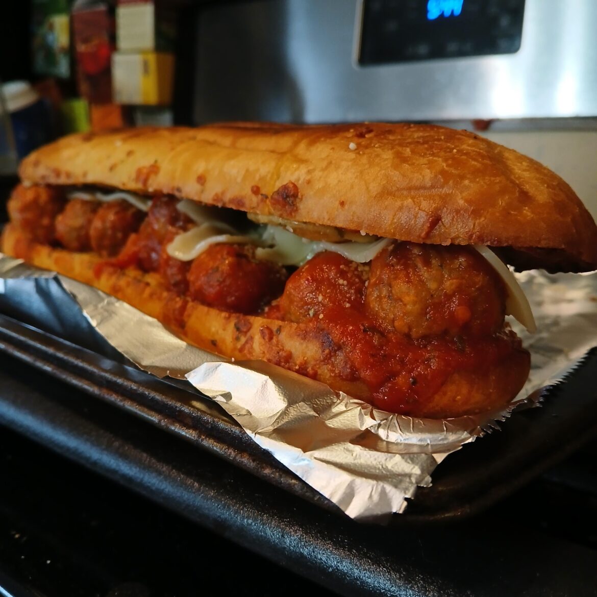 Meatball Sub on Garlic Bread, to be eaten at home so I don't care if I get sauce on myself.