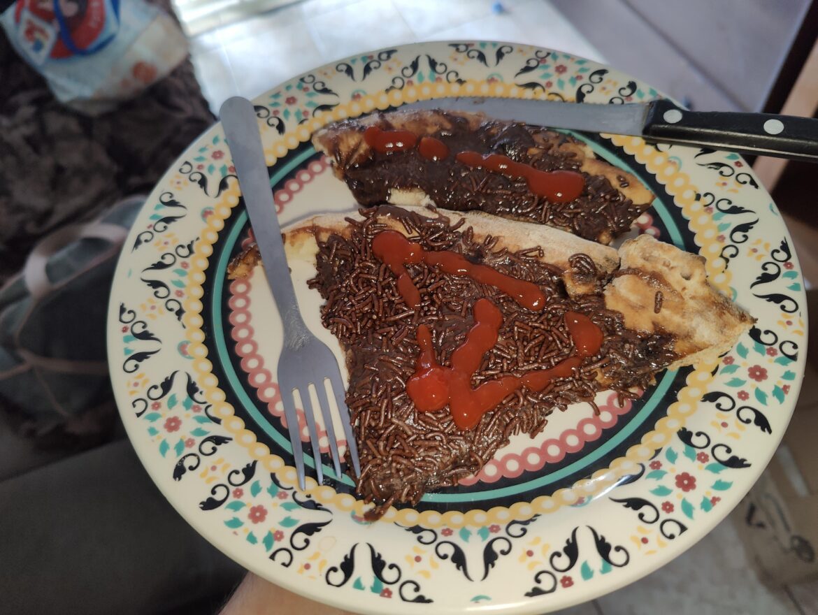 "I put ketchup on the chocolate pizza to see if it tastes better."