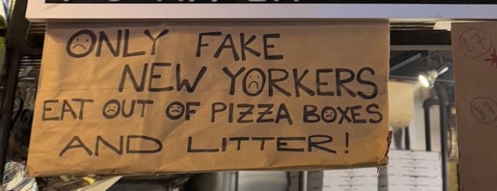 Do you agree with the message on this sign at L'Industrie? Are we really fake if we eat of pizza boxes?