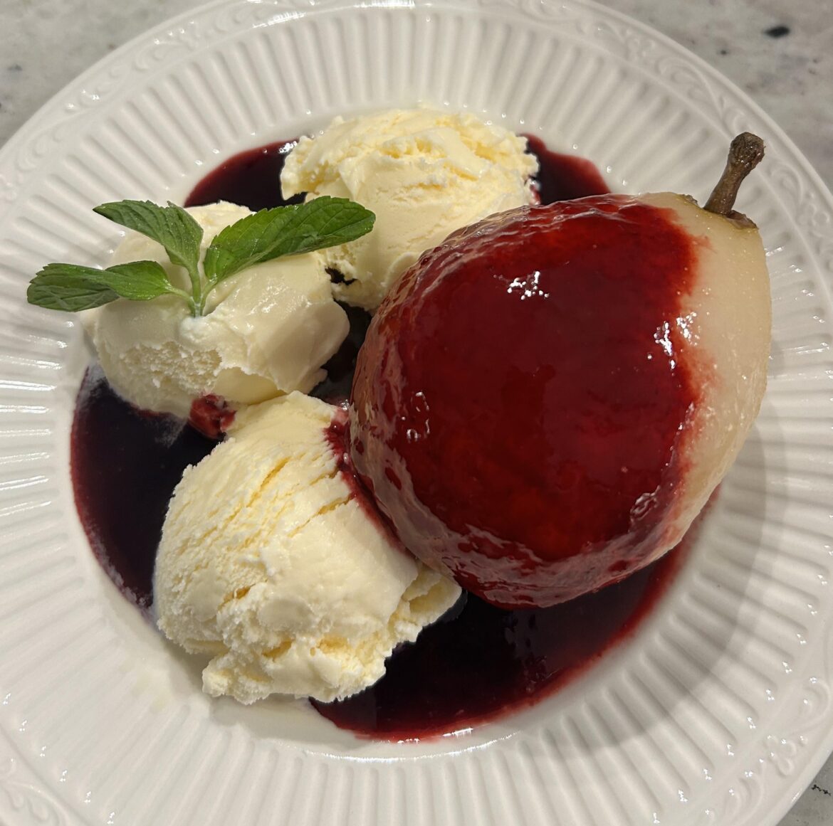 Poached Pear with Pomegranate Blackberry syrup