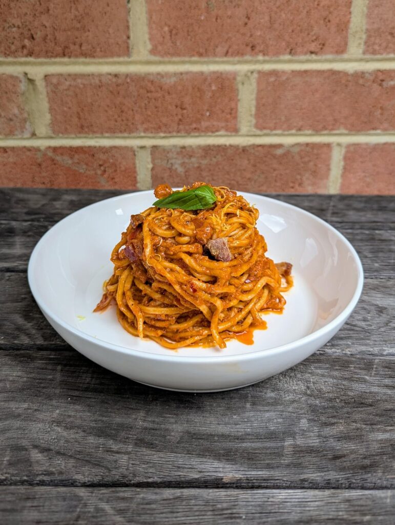 Home made Spaghetti alla chitarra con pomodorini, 'nduja e guanciale