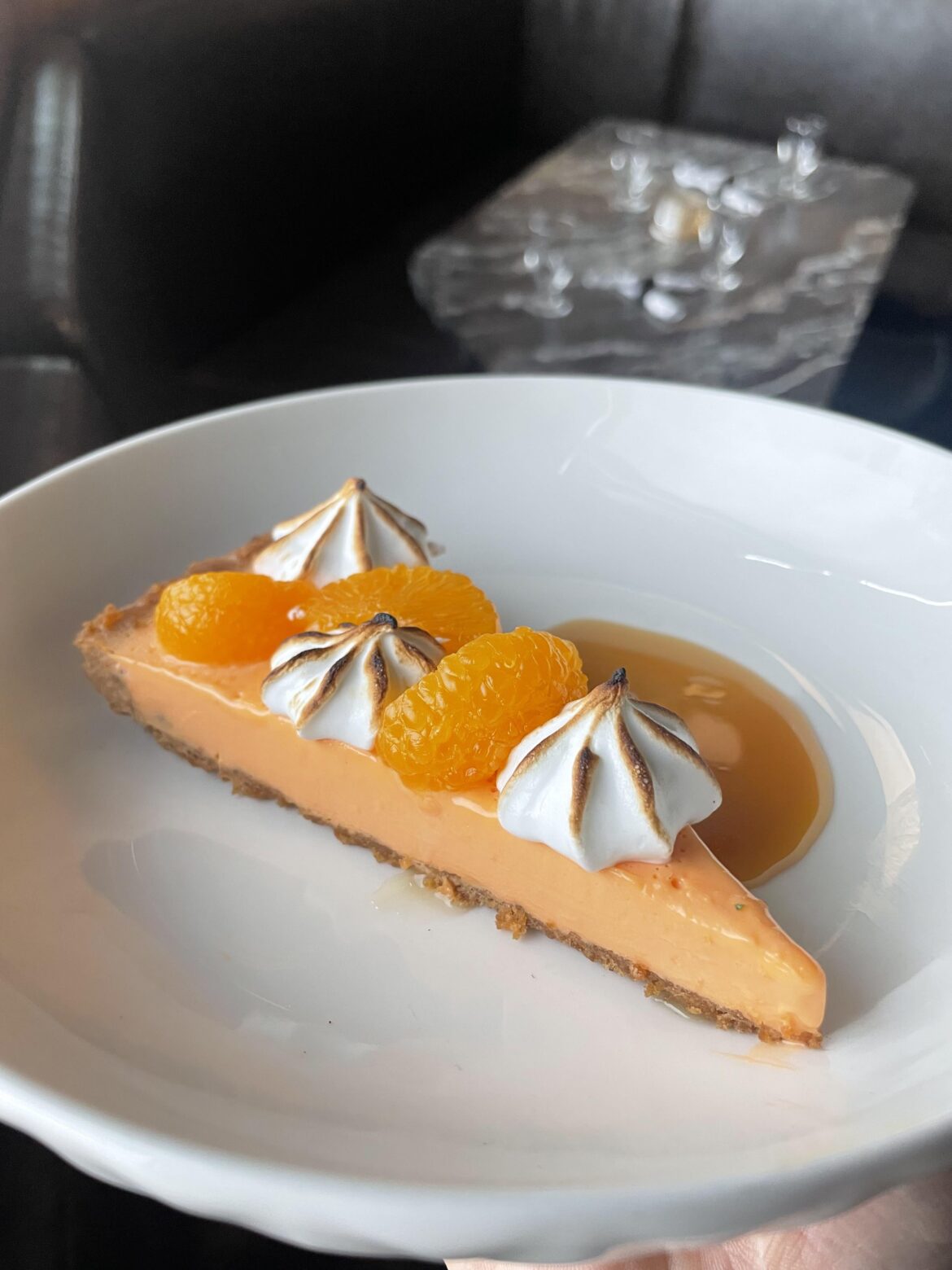 Mandarin creamsicle cheesecake, waffle cone crust, toasted meringue, caramelized honey