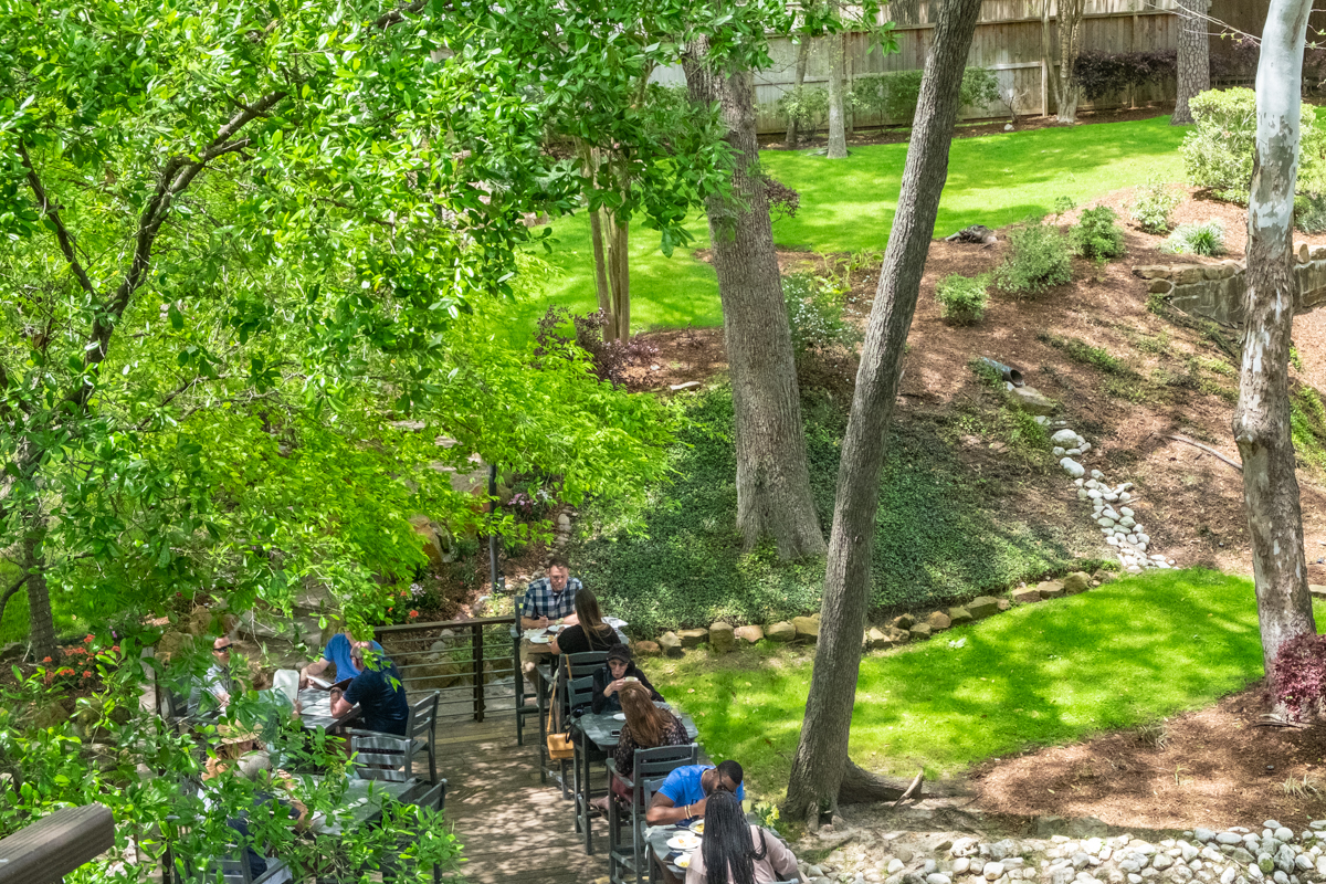 patio with tables and trees