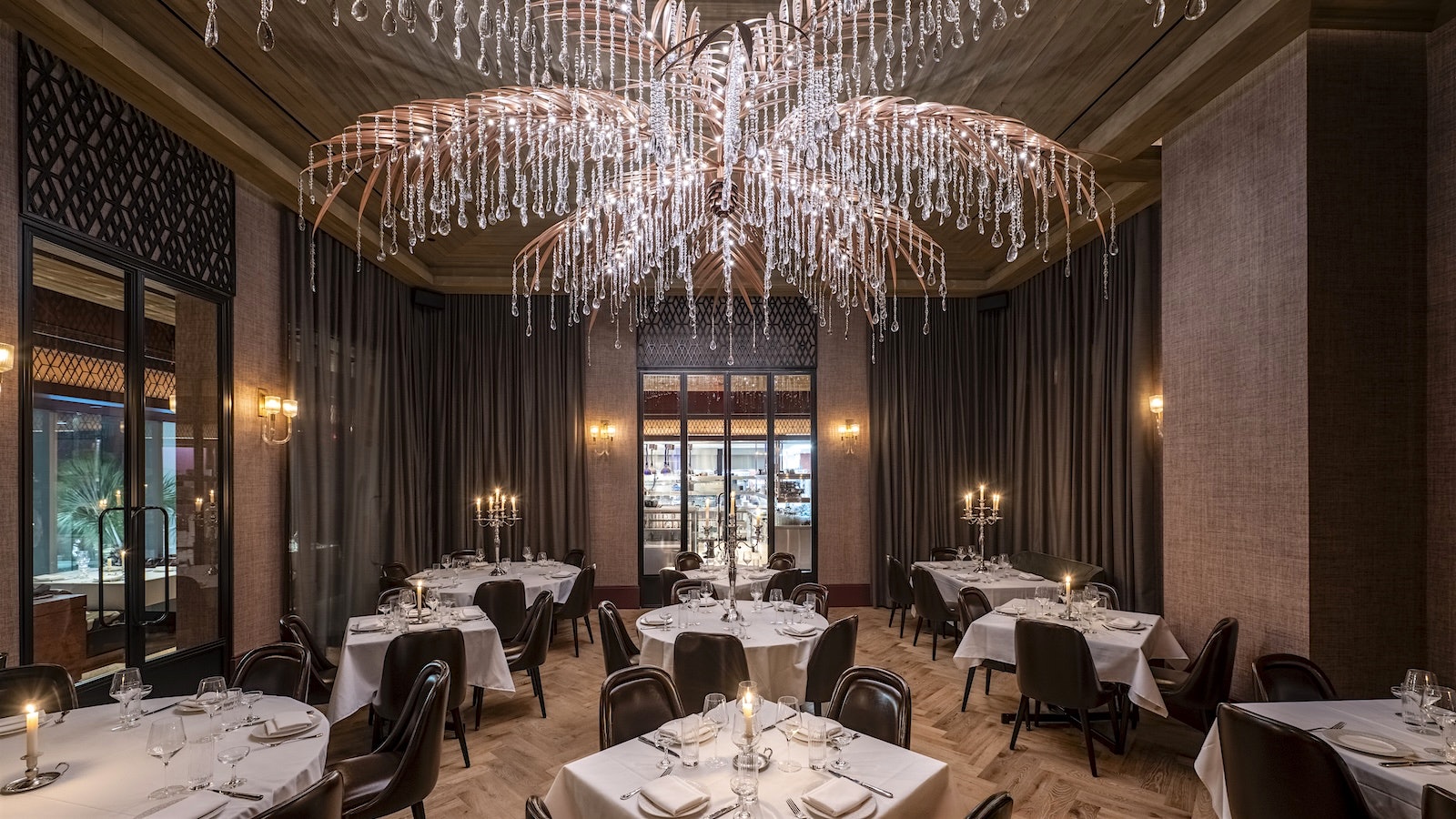  The interior of Maple and Ash in Miami with a beaded sculpture of a palm tree