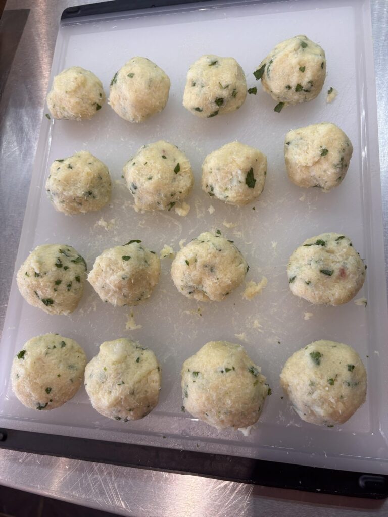 Mango chutney fish balls with cous cous & cucumber