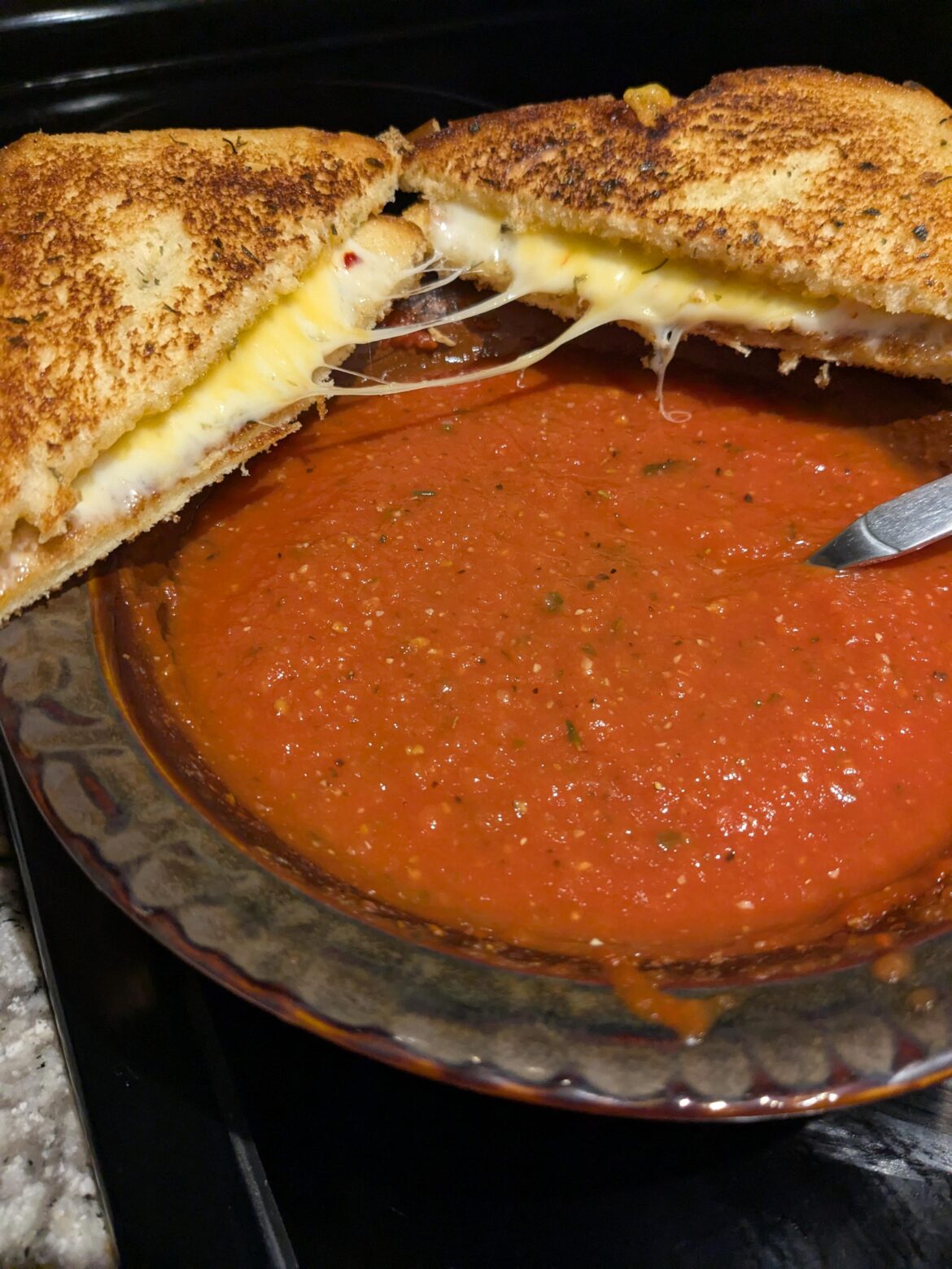 Homemade tomato soup and grilled cheese