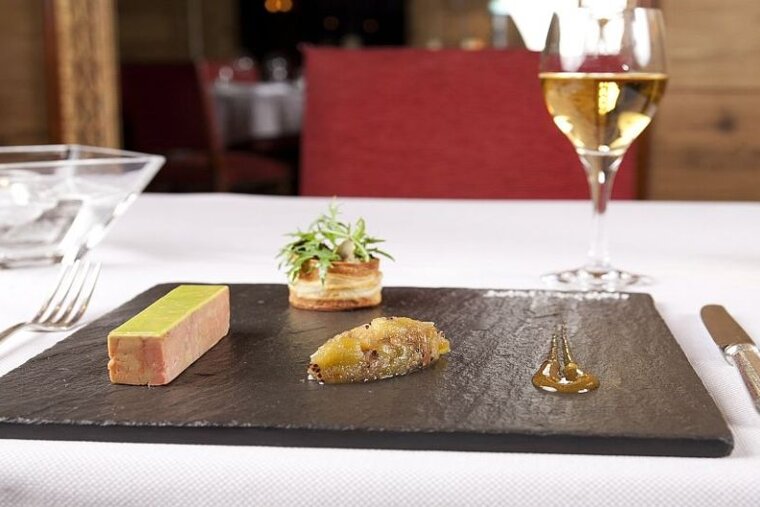 An image of a restaurant dessert and wine at a ski resort hotel in Morzine Portes du Soleil