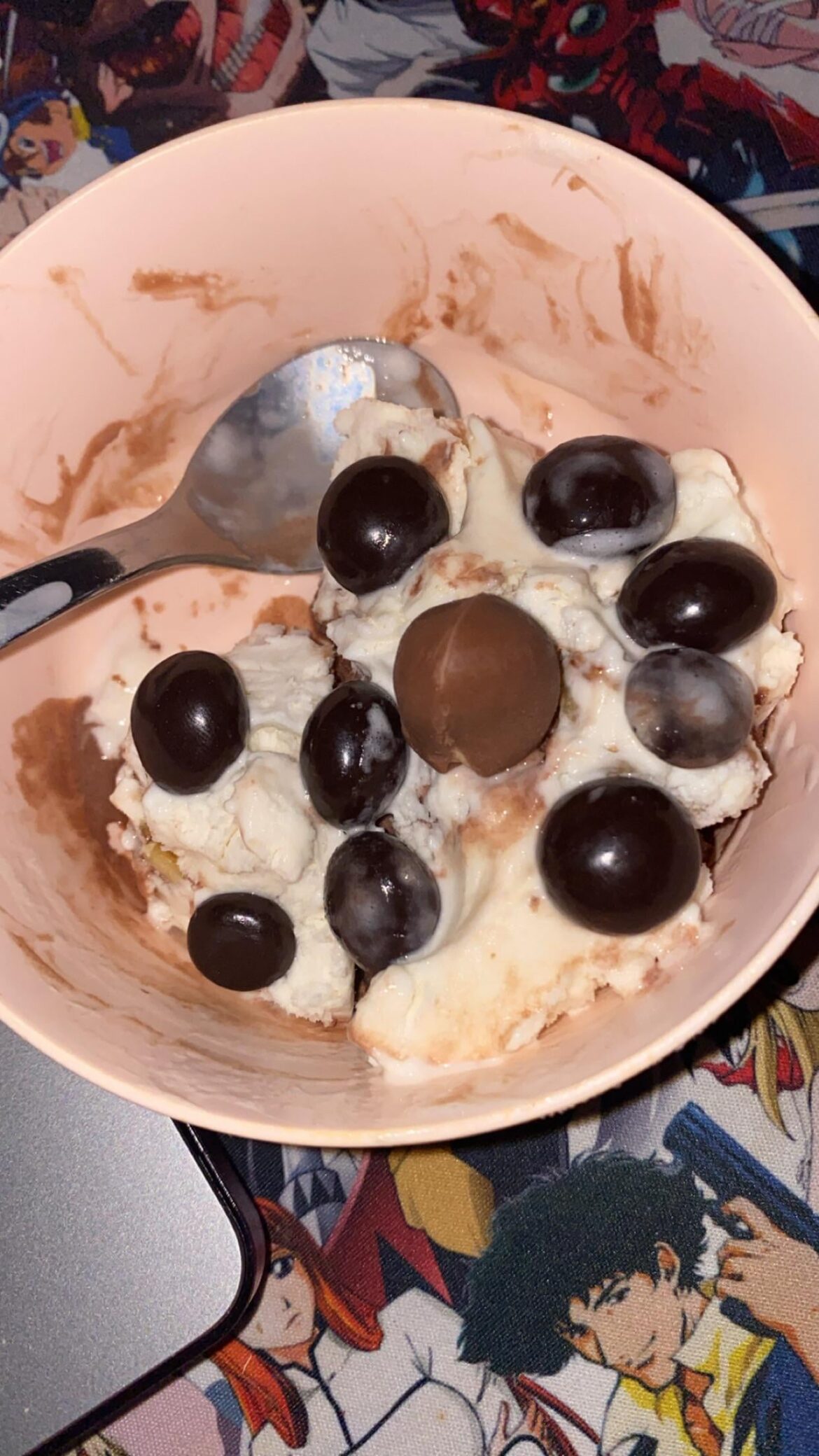 maple walnut ice cream with a layer of chocolate ice cream at the bottom, topped with brookside pomegranate chocolates and a hazelnut kinder mini egg