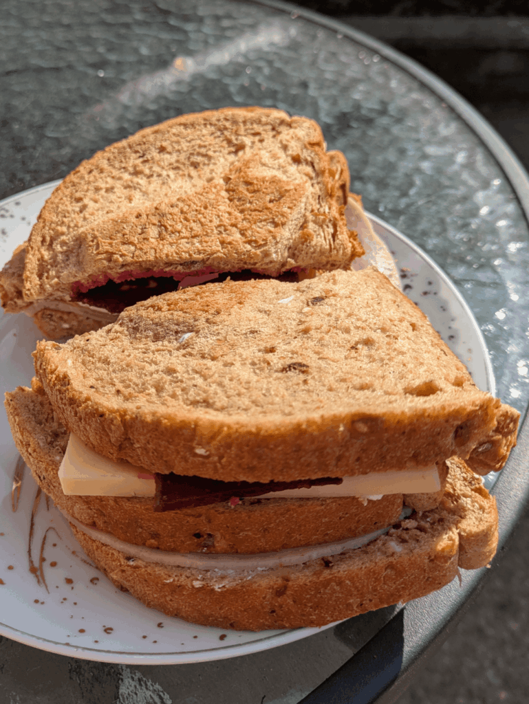Ham, English mustard, mature cheddar, beetroot and salad cream triple decker sandwich in the Yorkshire sun!