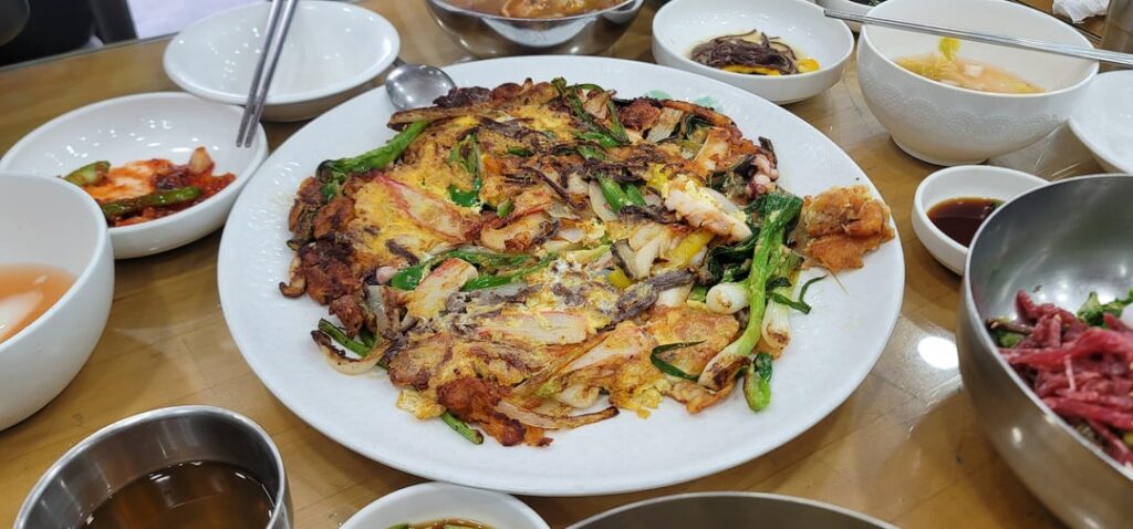 Seafood pancake and raw beef bibimbap at a locally famous restaurant in Busan