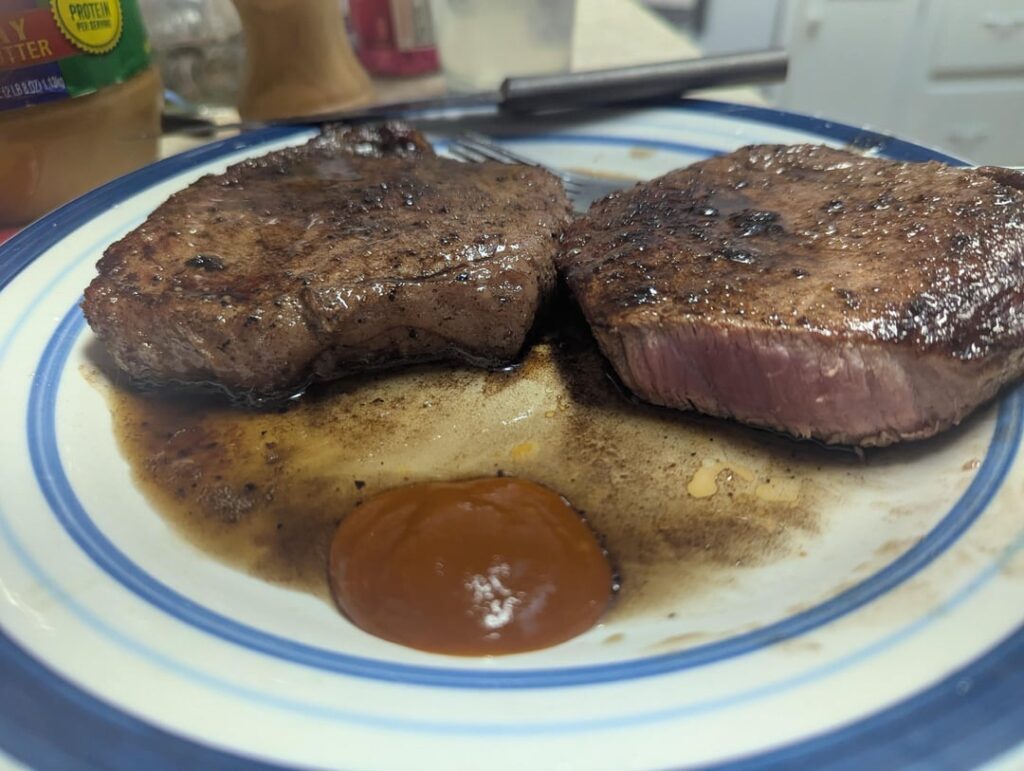 I like my steaks cooked Pittsburgh rare. But I don't know how to cook so I just eat them extremely undercooked.