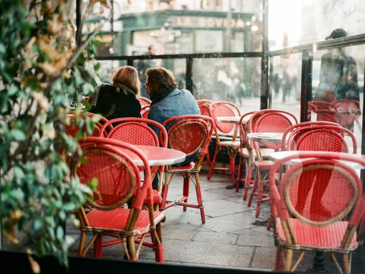Why More Hours May Not Be The Answer Two people in a café in Paris.