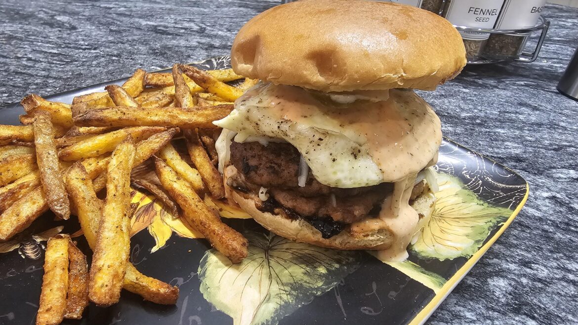 Double Smash Turkey Burger With Ghost Pepper Old Bay Sauce, Mozzarella Cheese, Caramelized Onions, Egg, and Jalapeños