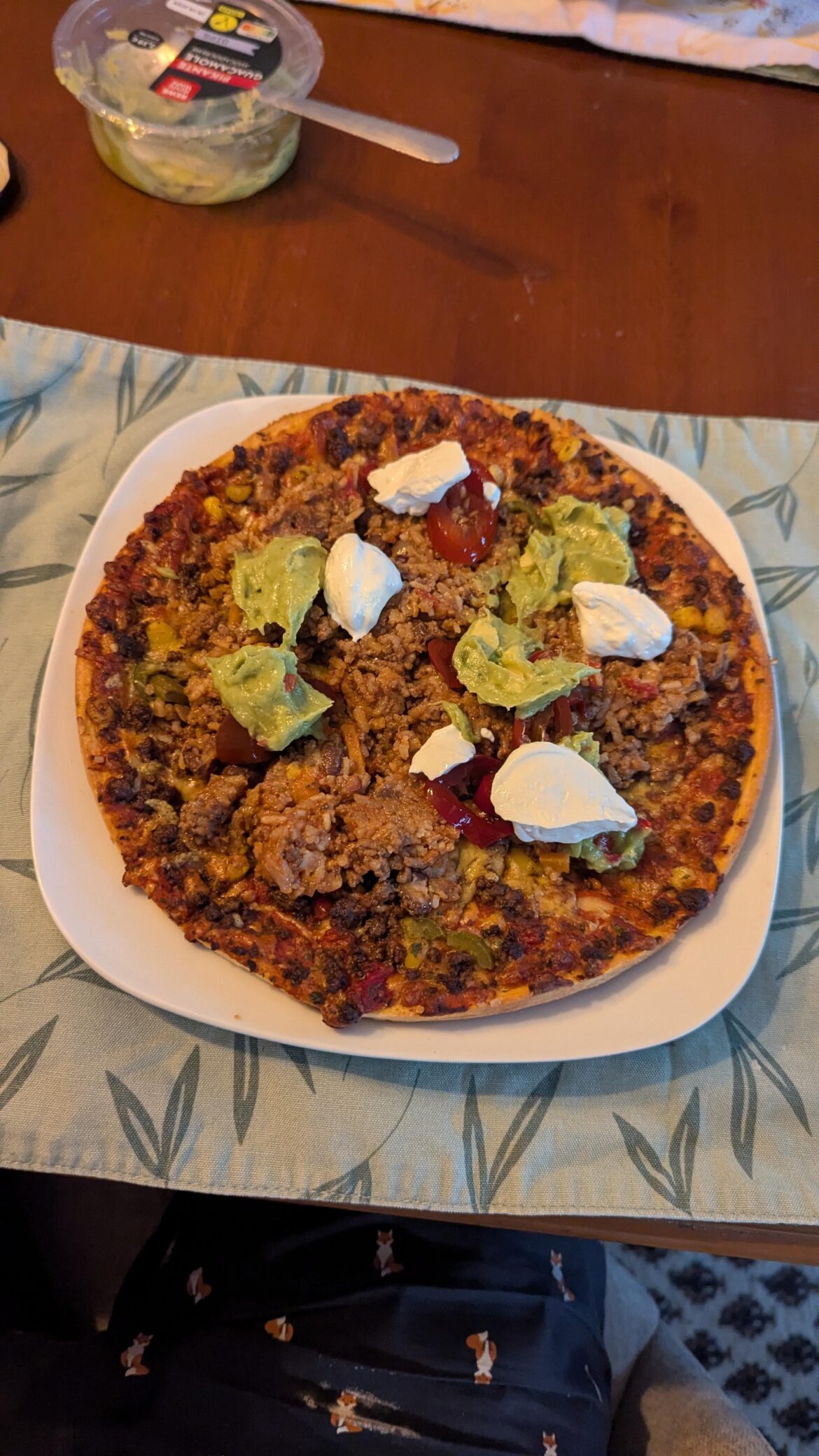 Added some extra meat, sour cream and guacamole to my Mexican pizza