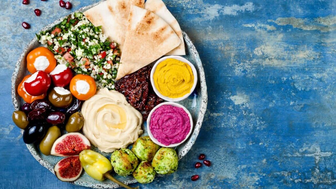 Why you should also love the ‘other’ Mediterranean diet: healthy Middle Eastern cuisine Middle Eastern meze platter with green falafel, pita, sun dried tomatoes, pumpkin and beet hummus, olives, stuffed peppers, tabbouleh, figs.