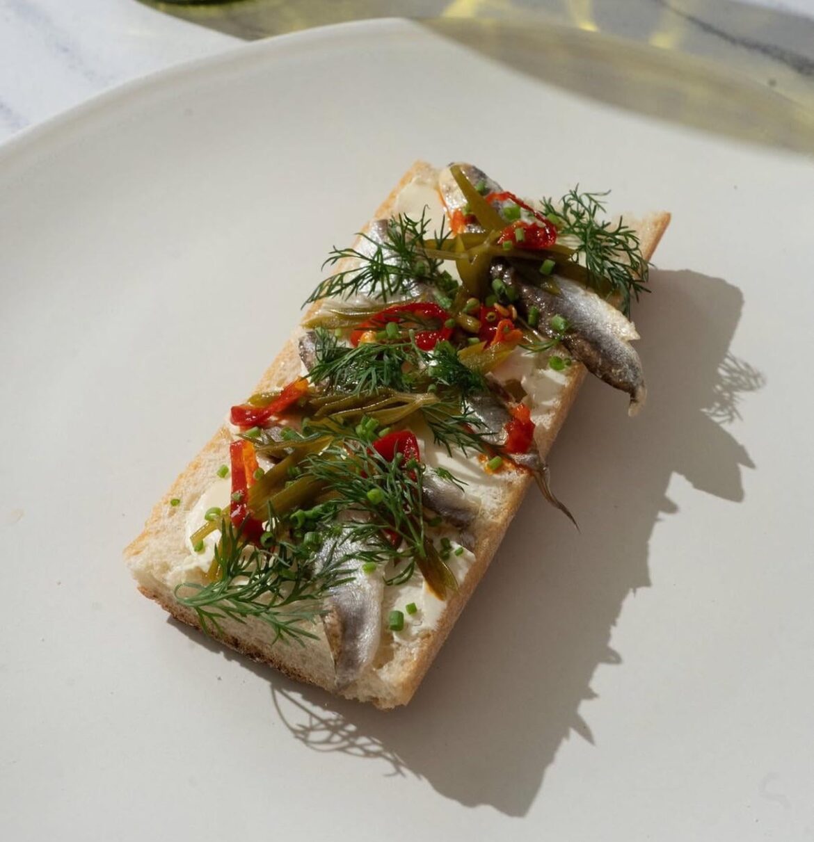 Anchovy, sea fennel, and butter on bread.