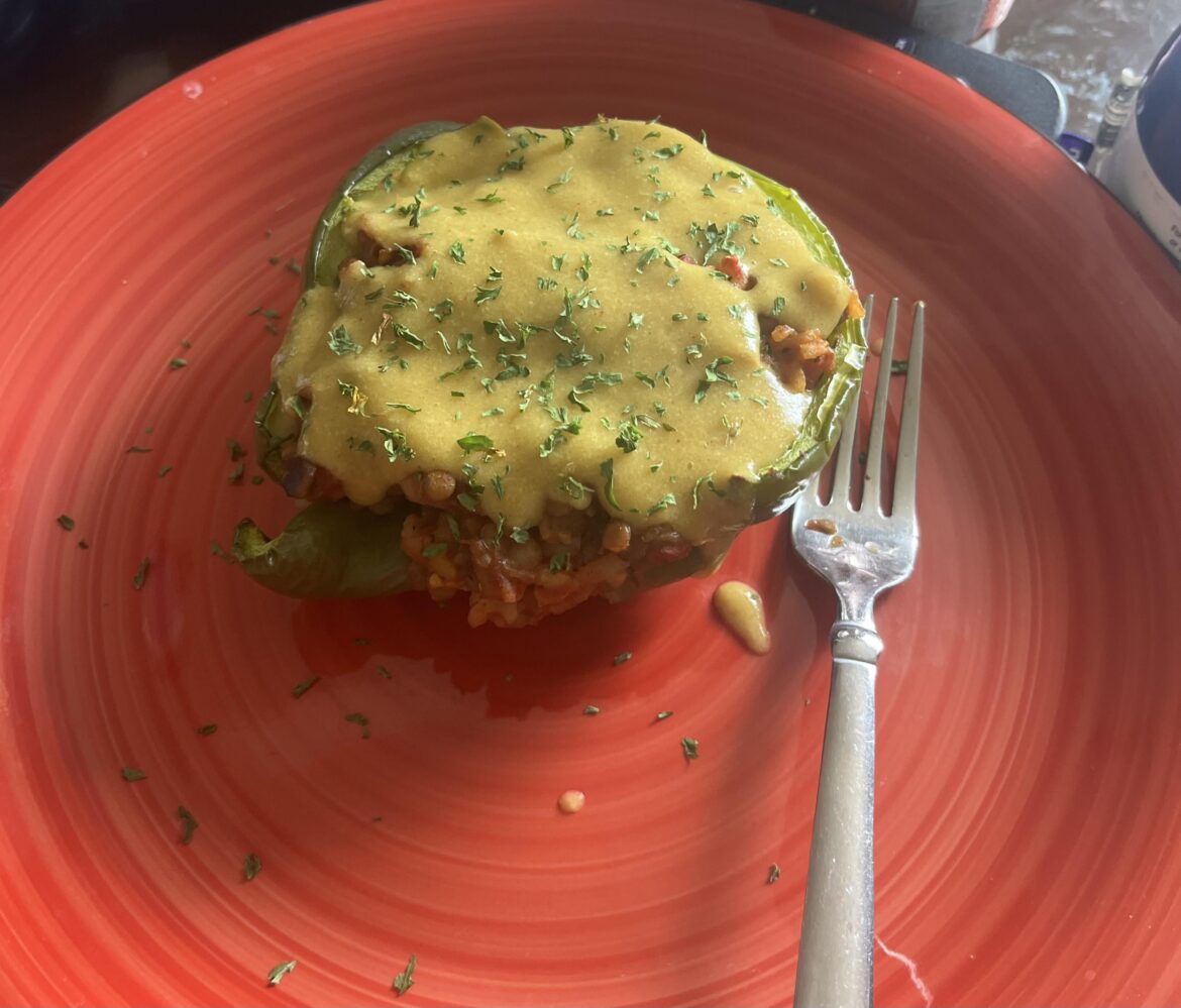 vegan stuffed peppers with “cheese” sauce