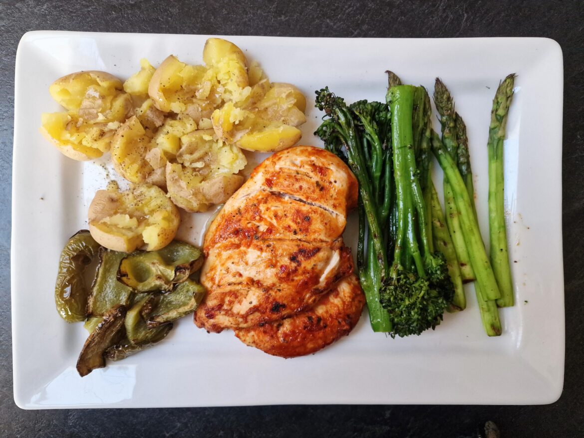 Peri Peri chicken breast, crushed baby potatoes, grilled tenderstem broccoli and asparagus, roasted green peppers.