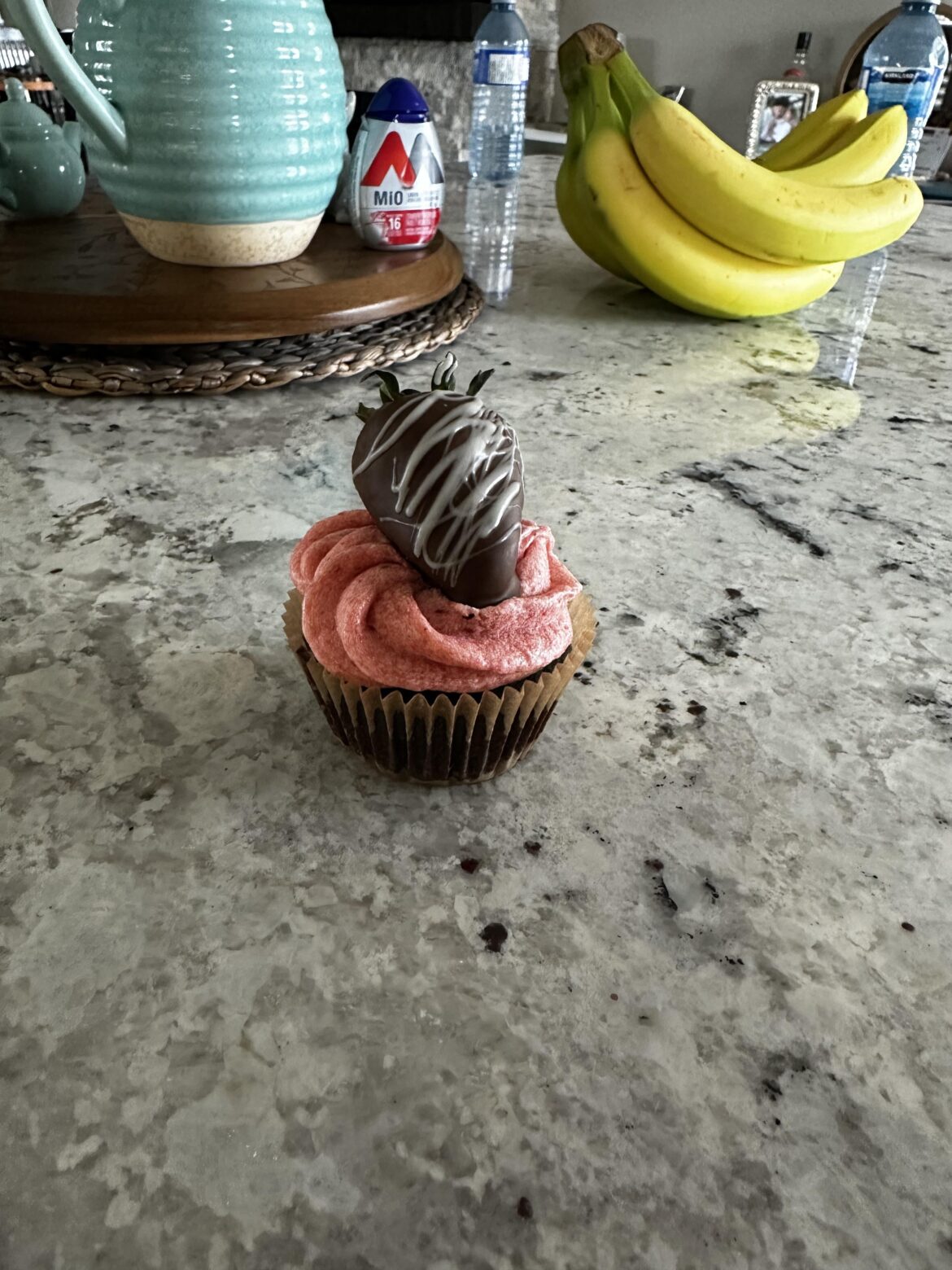 Chocolate dipped strawberry cupcakes with strawberry jam filling