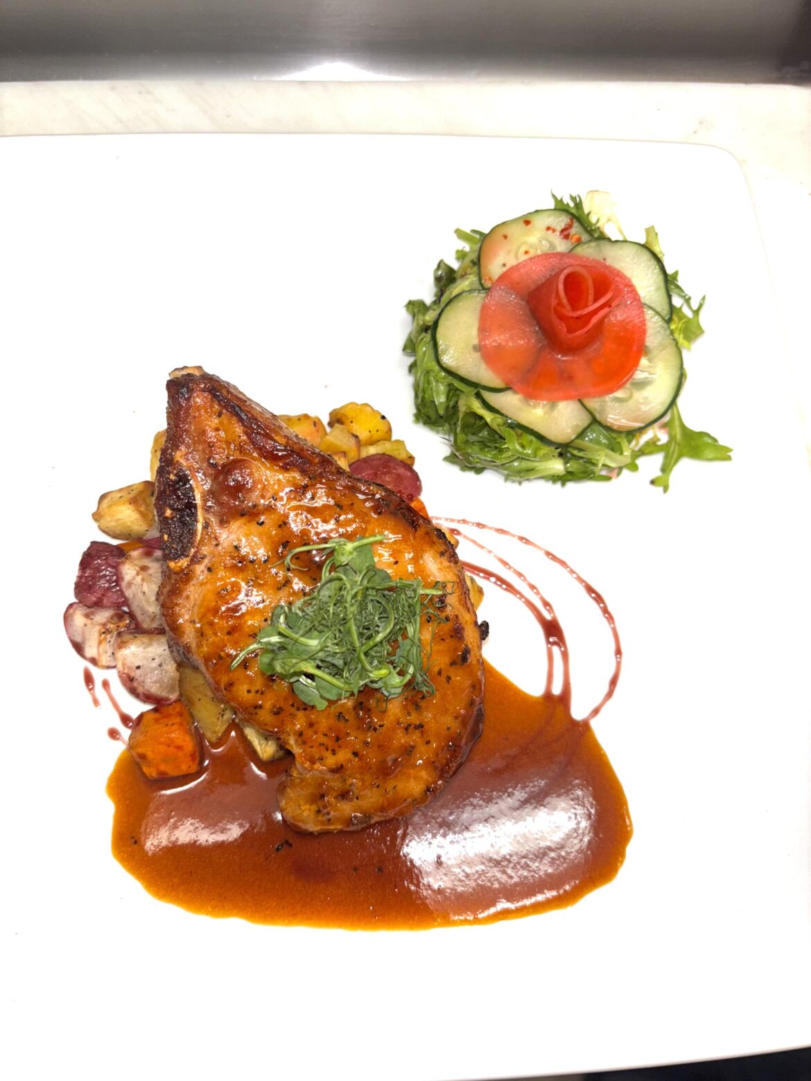 Heluka Pork Chop w/ Roasted Root Veg Medley, Frisée Pickled Watermelon Radish Salad & Lux Cherry Demi Glacé Heluka Pork Chop w/ Roasted Root Veg Medley, Frisée Pickled Watermelon Radish Salad & Lux Cherry Demi Glacé