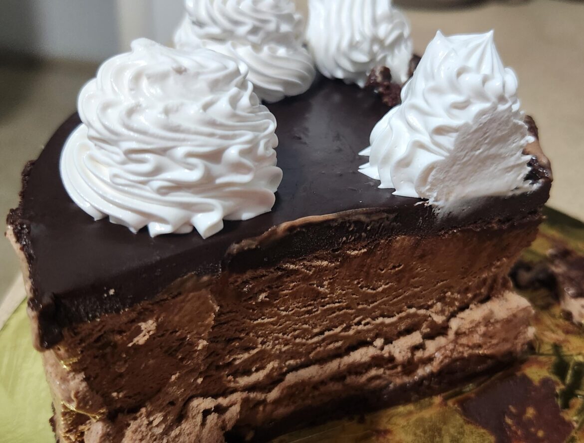 Chocolate mousse cake with sweet cream on top
