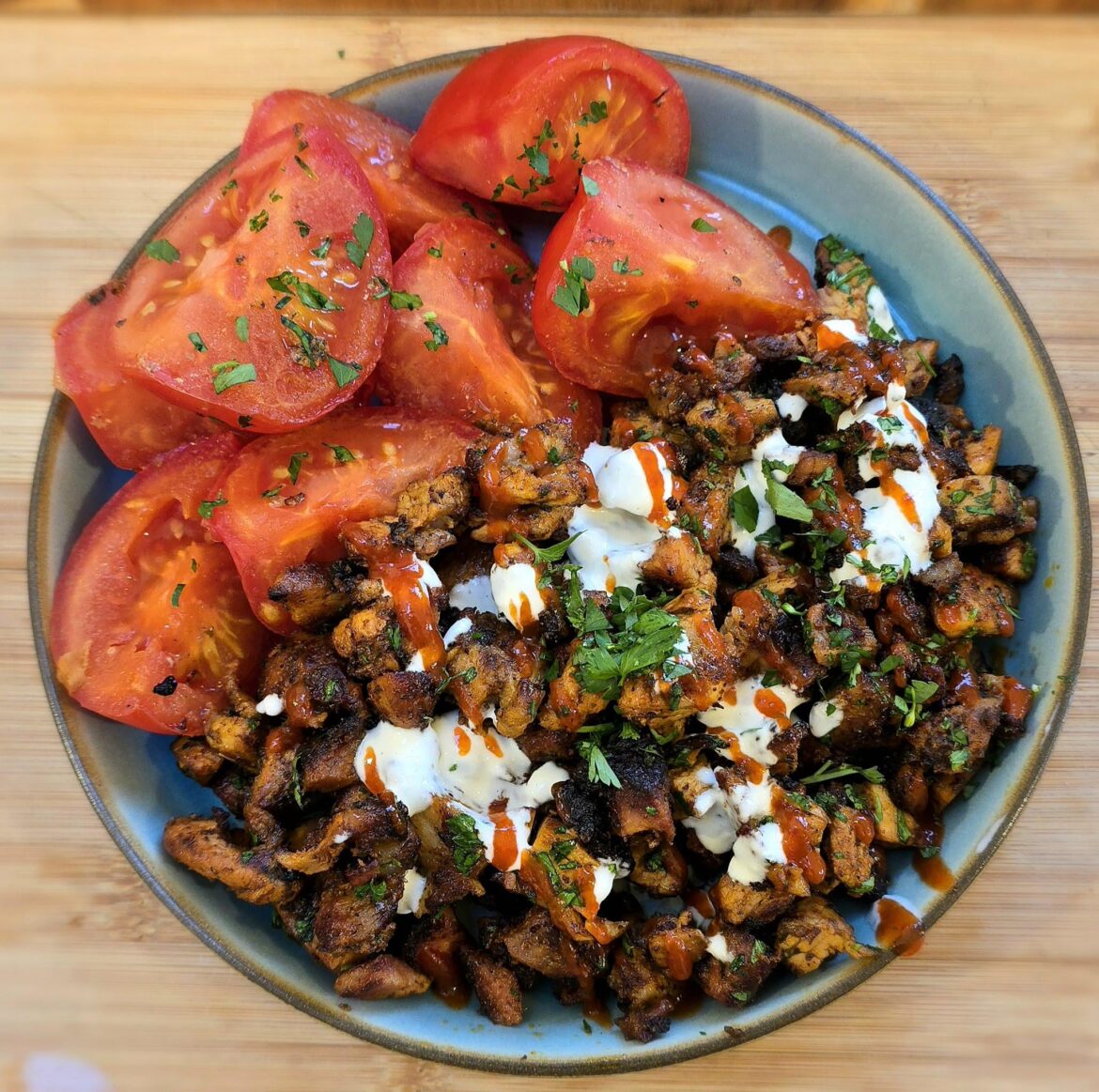 Pork shawarma, garlic yoghurt sauce, chilli sauce and roasted tomatoes