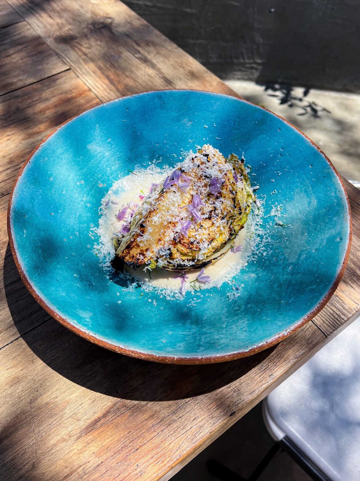 Cabbage grilled w red miso butter, smoked cream sauce, Parmigiano & Chay flowers