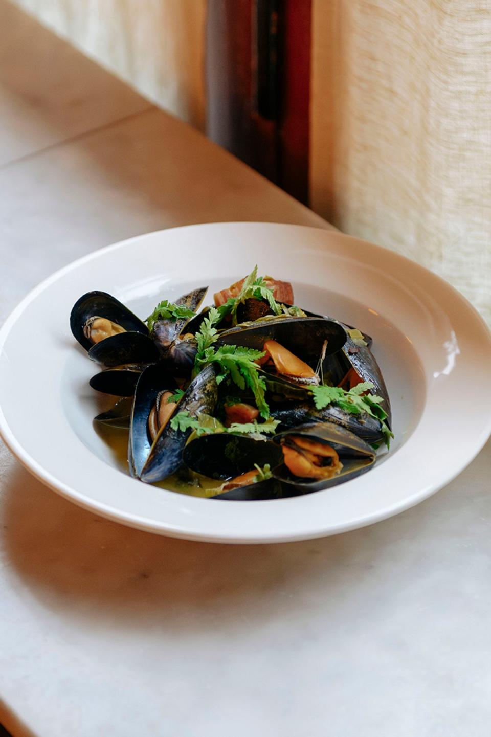 Marseille in a bowl, with smoky bacon and an anise-scented broth begging for bread (Supplied)