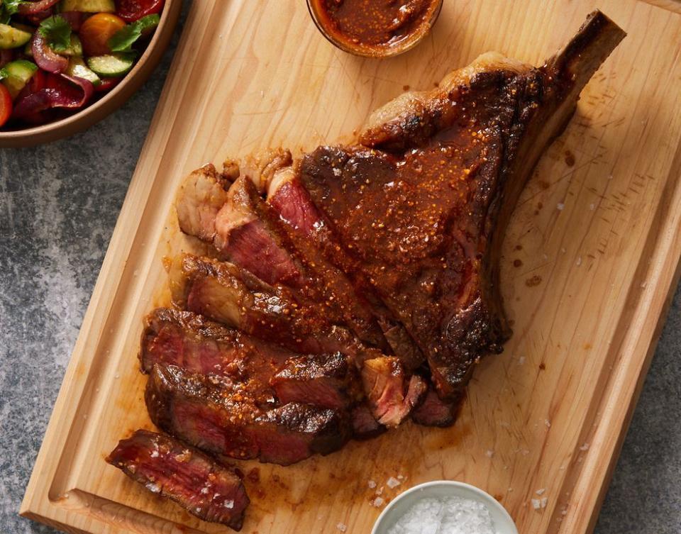 cowboy steak with grilled red onion salad