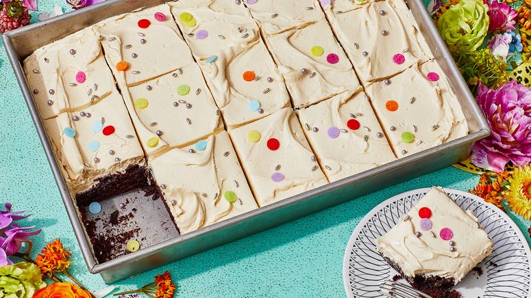 Sheet cake on a glitter background with flowers.