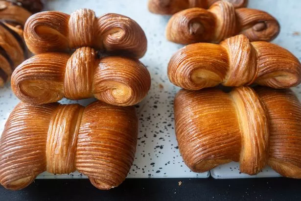 A tray of homemade pastry bowties by a woman who started baking in lockdown. There are six on the tray.